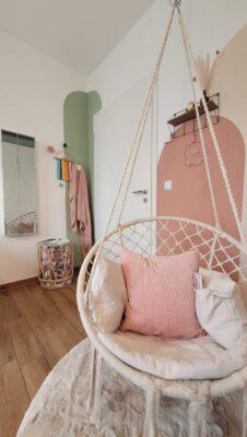 Girl's room fun zone with hanging chair and wardrobe